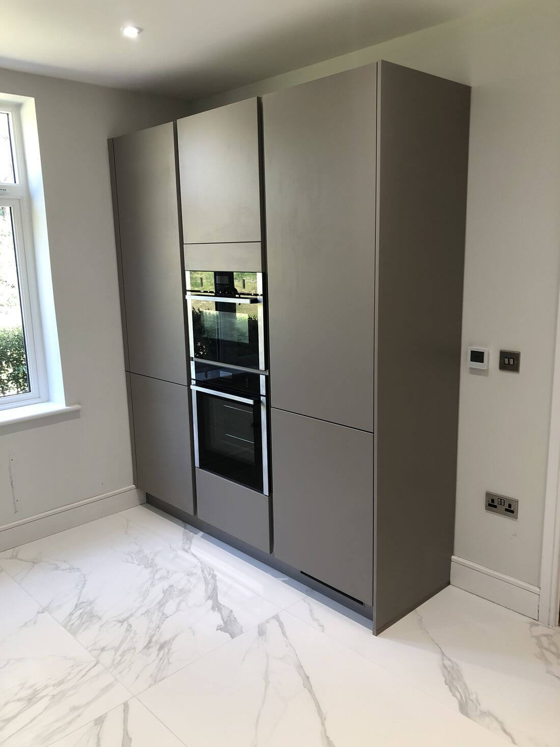 Full height kitchen storage cupboards