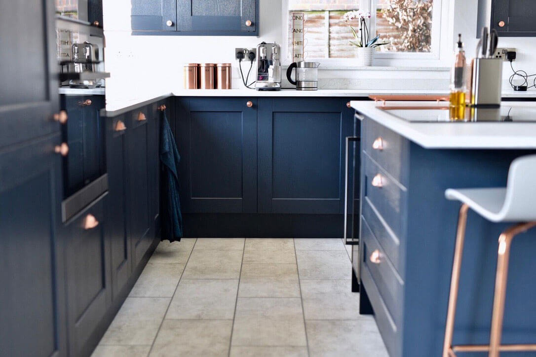 Navy kitchen with rose gold touches